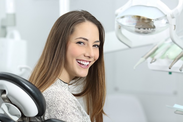 Woman sitting in dentist chair