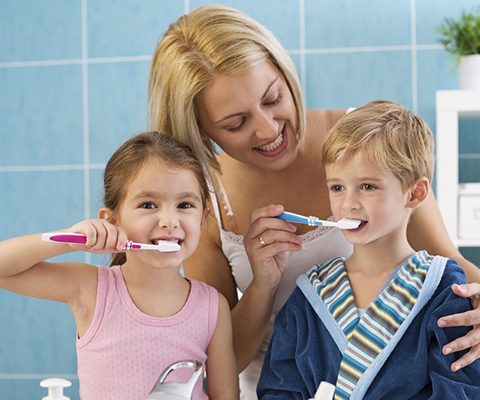 Family brushing teeth