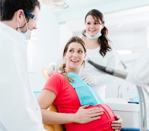 Pregnant woman at dentist before treatment