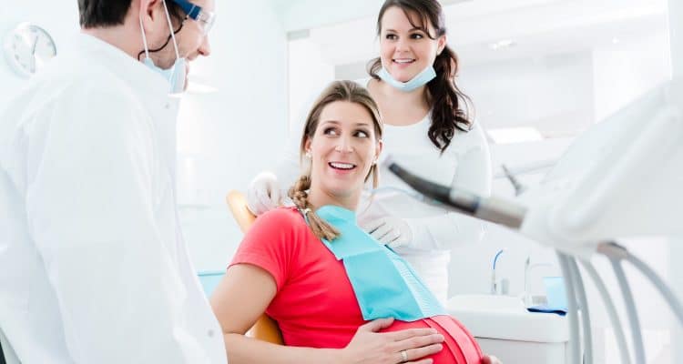 Pregnant woman at dentist before treatment