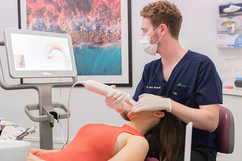 dentist viewing results with patient dentist viewing results with patient