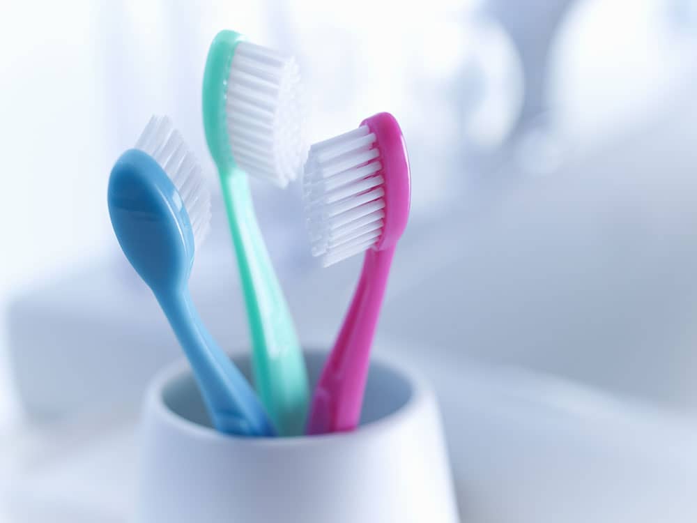 manual toothbrushes in bathroom