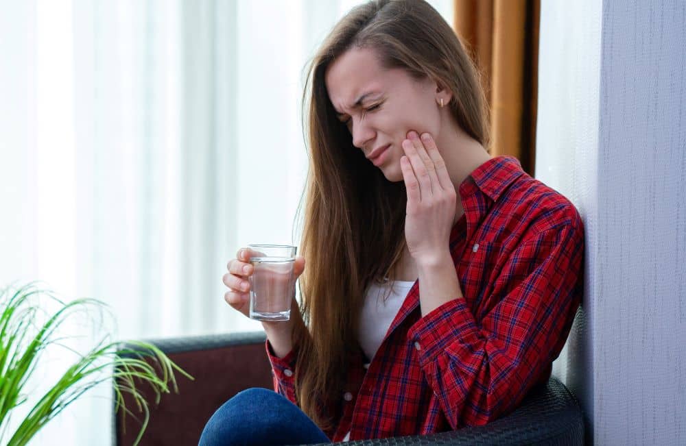 Young woman with mouth sore.