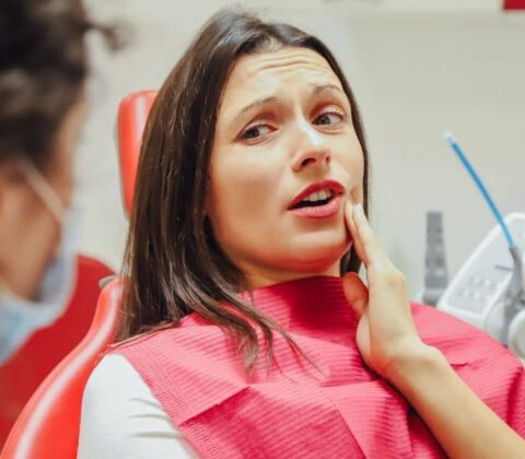 Anxious woman during dental check-up.