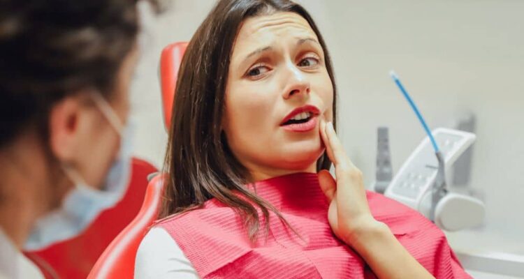 Anxious woman during dental check-up.