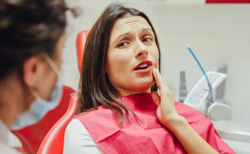 Anxious woman during dental check-up.