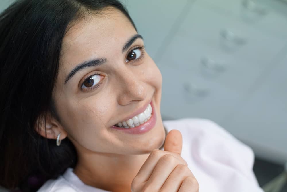 Woman with perfect teeth smiling.