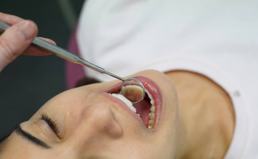 Poor dental hygiene leads to bad breath, yellowing teeth, and red gums.