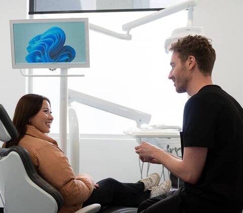patient in chair with dentist