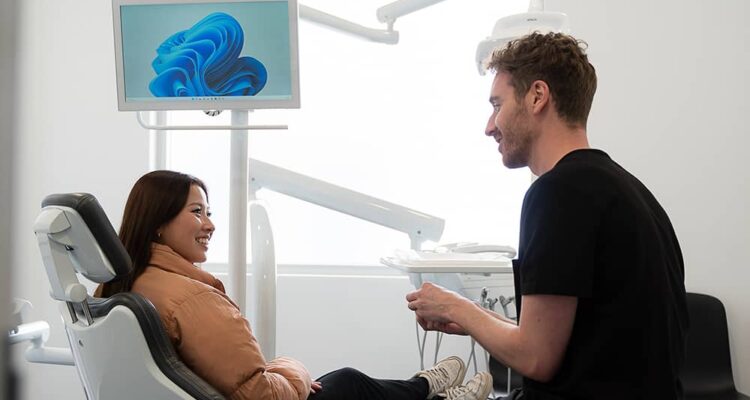 patient in chair with dentist