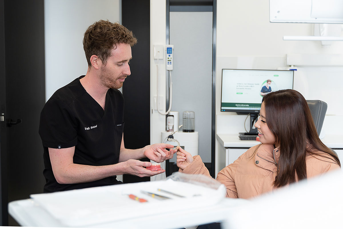 a patient discussing invisalign with a dentist