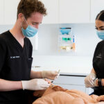 dentist working on patient in chair