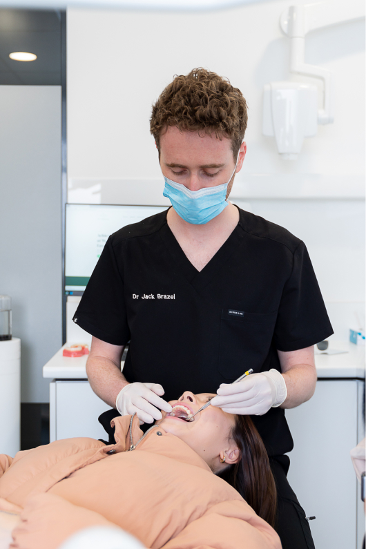 Dentist checking teeth during general dentist appointment