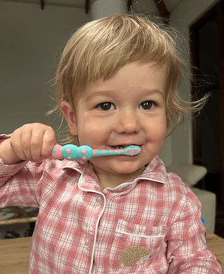 little kid brushing teeth