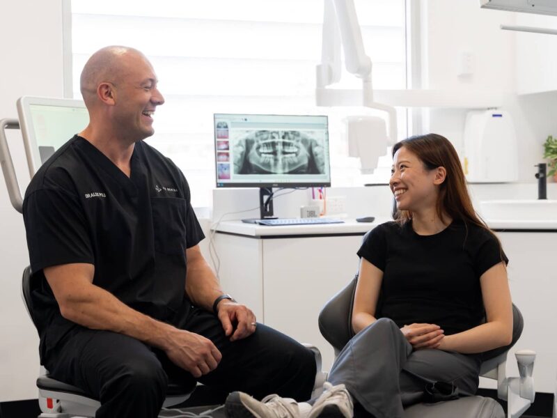 dentist talking to patient during general check up
