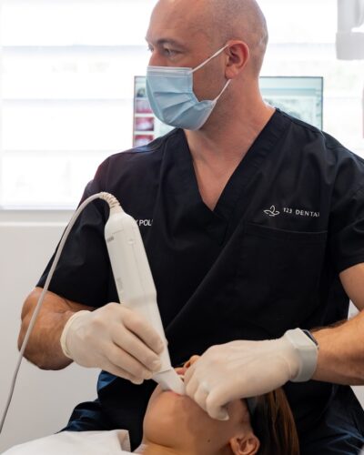 dental-crown-cosmetic dentist taking an xray of dental crown