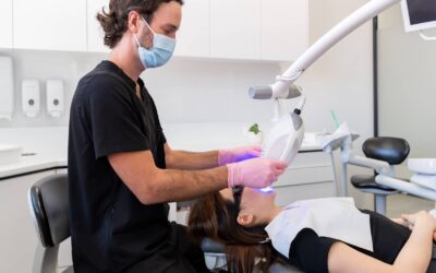 dentist doing professional teeth whitening