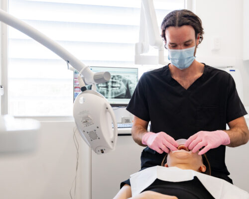 teeth-whitening-prep dentist prepping teeth for teeth whitening