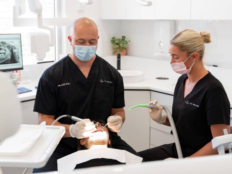 scale-and-clean-dentist Experienced dentist at 123 Dental performing a professional scale and clean treatment in Perth