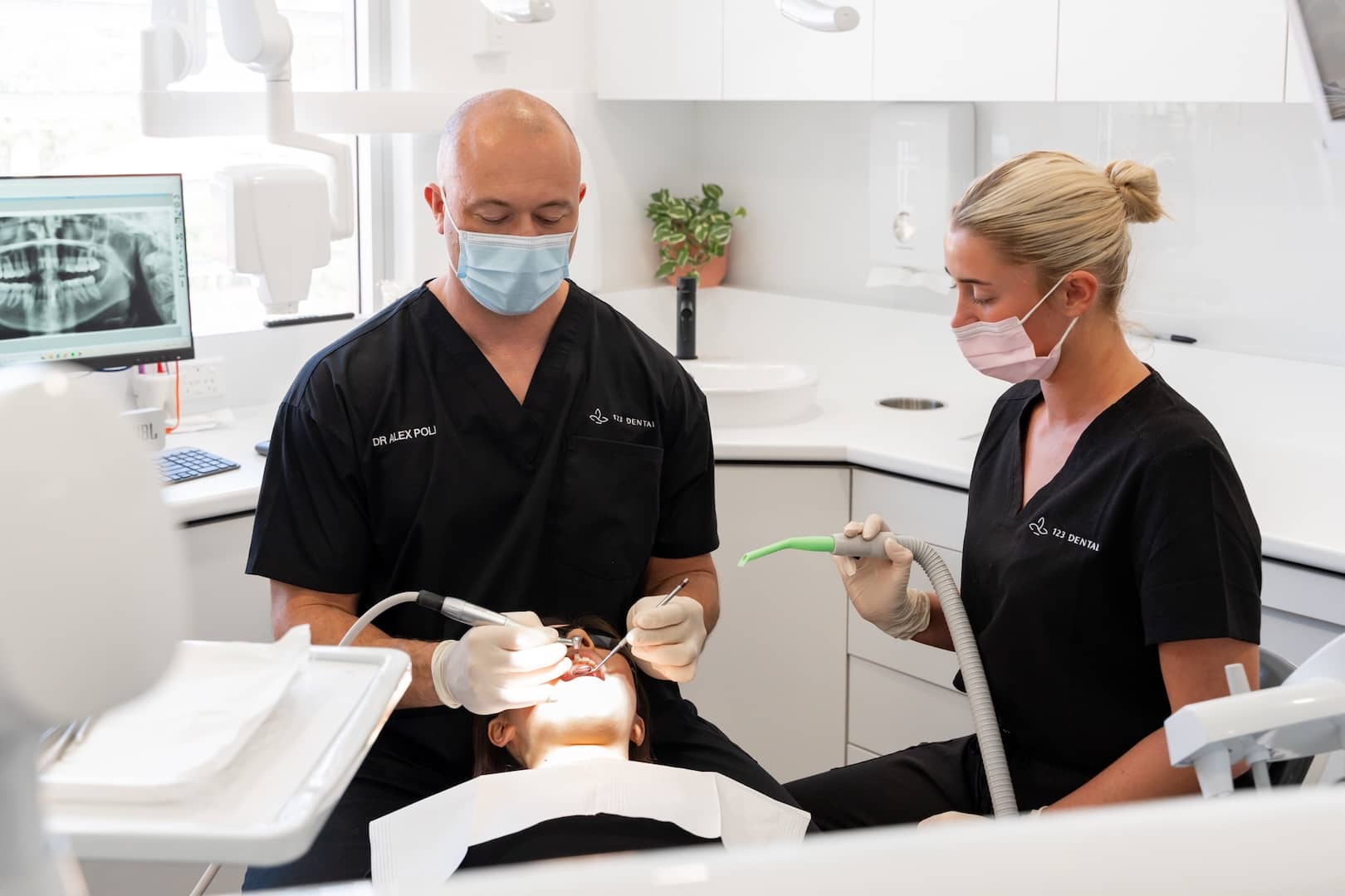 Experienced dentist at 123 Dental performing a professional scale and clean treatment in Perth