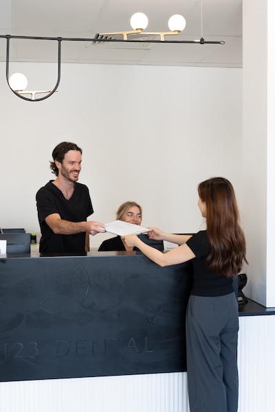 patient-form patient filling out form for 123 dental