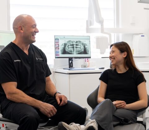 dentist talking to patient